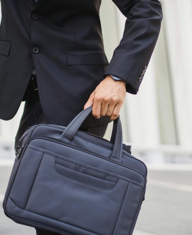 a man in a suit holding a briefcase